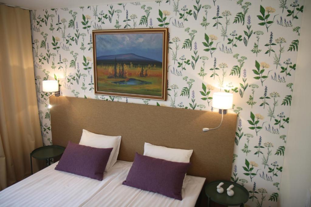 Postel nebo postele na pokoji v ubytování Hotel Aakenus