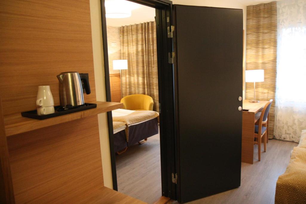 Postel nebo postele na pokoji v ubytování Hotel Aakenus