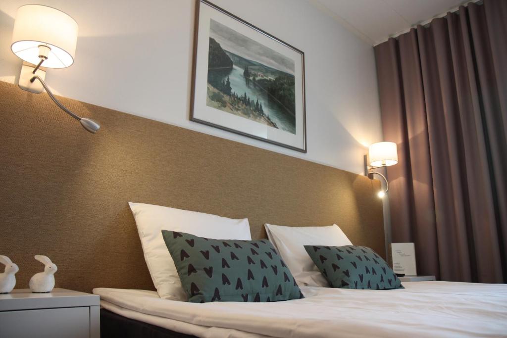 Postel nebo postele na pokoji v ubytování Hotel Aakenus