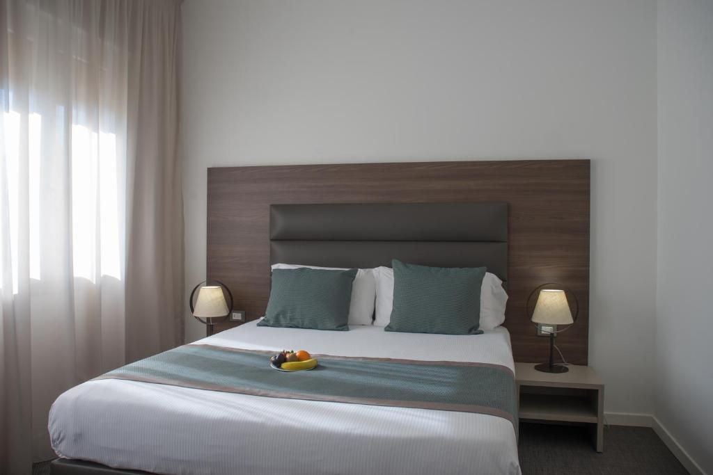 Postel nebo postele na pokoji v ubytování Hotel Villa Sorriso