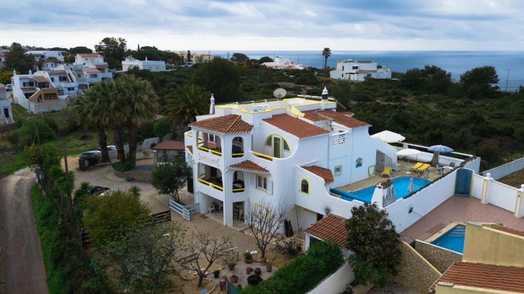 an aerial view of a white house with a swimming pool at Vila Horizonte in Carvoeiro
