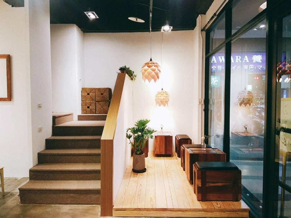 a store lobby with stairs and a stair case at Homey House in Taipei