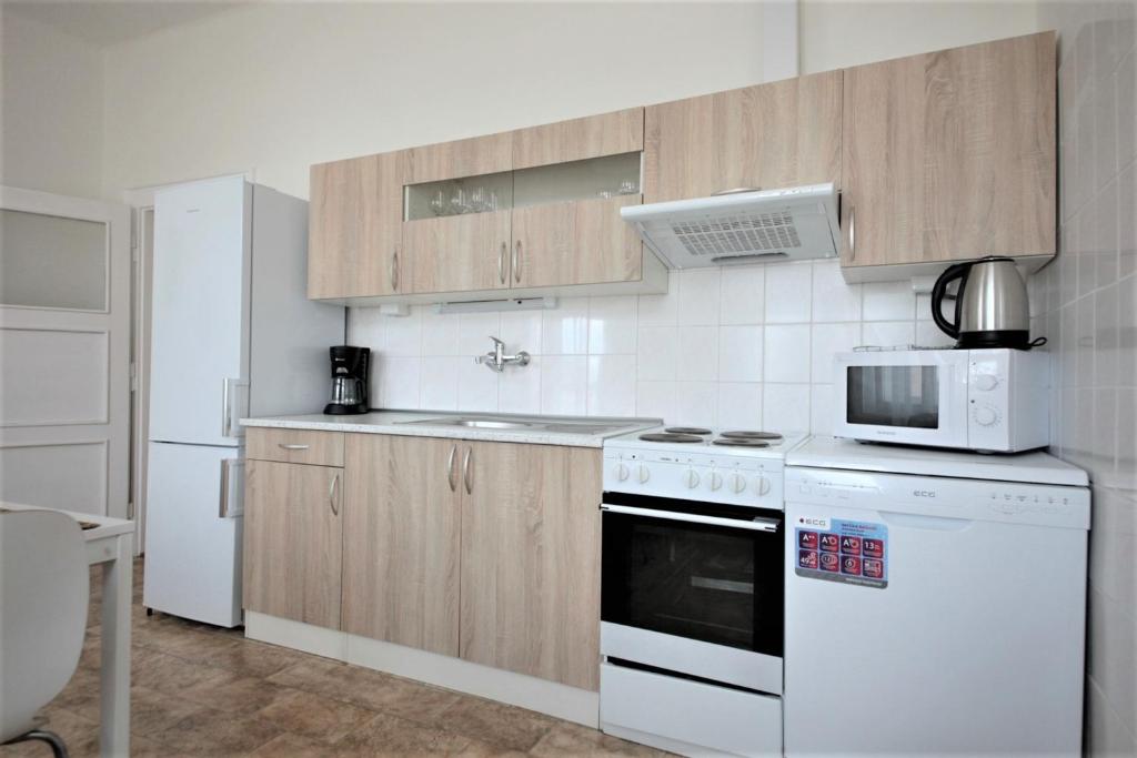Kuchyň nebo kuchyňský kout v ubytování Angel City Aparthotel