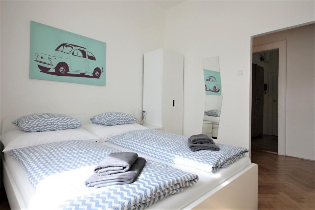 Postel nebo postele na pokoji v ubytování Angel City Aparthotel