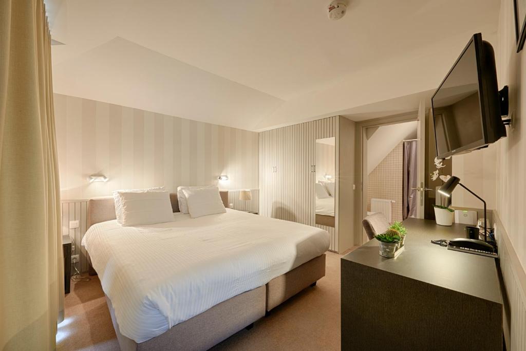 Postel nebo postele na pokoji v ubytování Hotel 't Putje