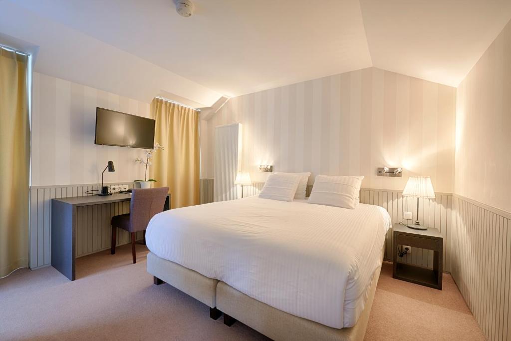 Postel nebo postele na pokoji v ubytování Hotel 't Putje