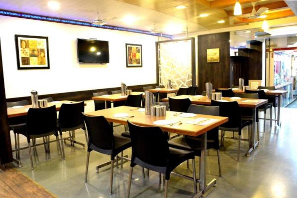 A restaurant or other place to eat at Hotel Vyankatesh & Pure Veg Restaurant