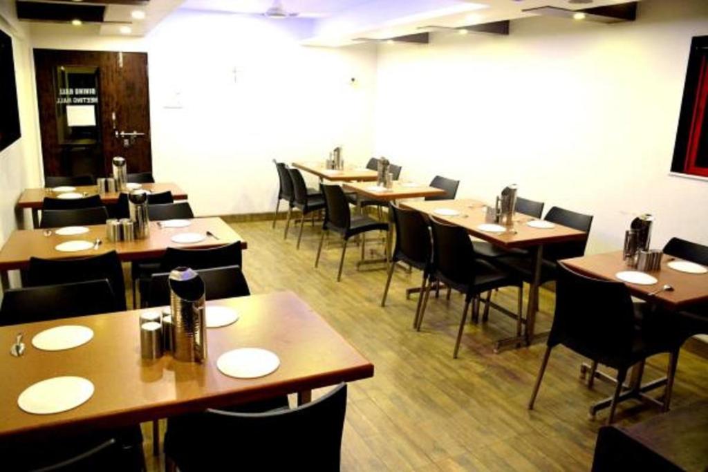 A restaurant or other place to eat at Hotel Vyankatesh & Pure Veg Restaurant