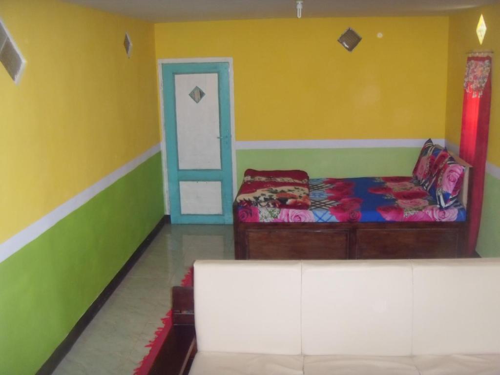 Postel nebo postele na pokoji v ubytování Cahyo Homestay Bromo