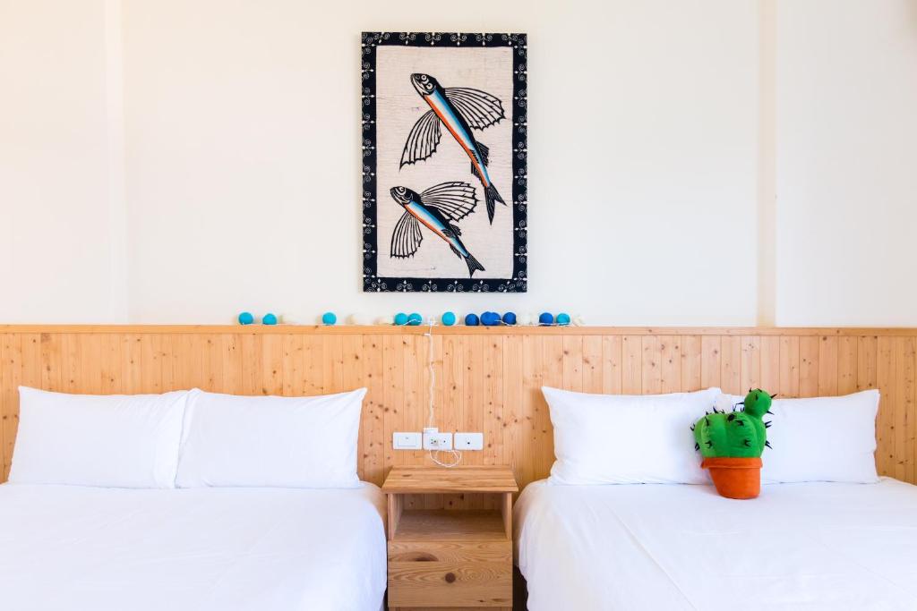 Postel nebo postele na pokoji v ubytování Cozy Green Guesthouse