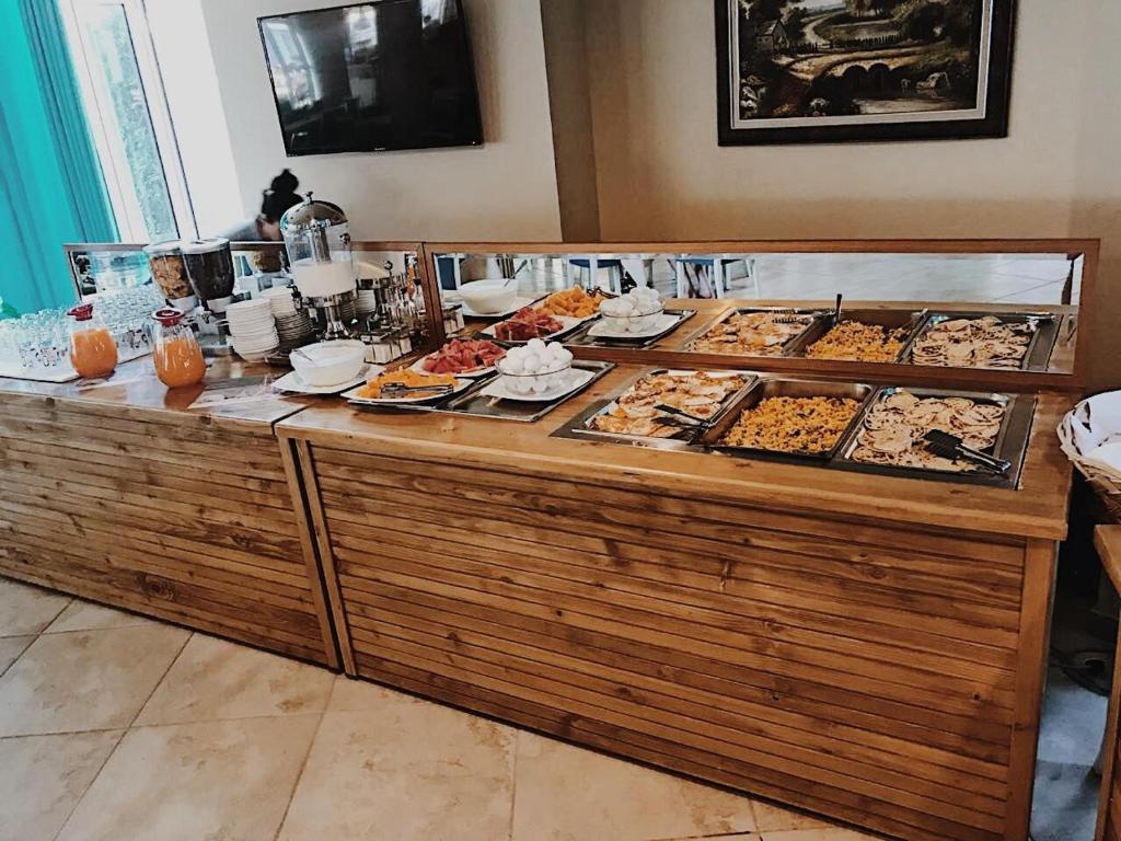 a buffet line with many different types of food at Hotel ANTAG in Shëngjin