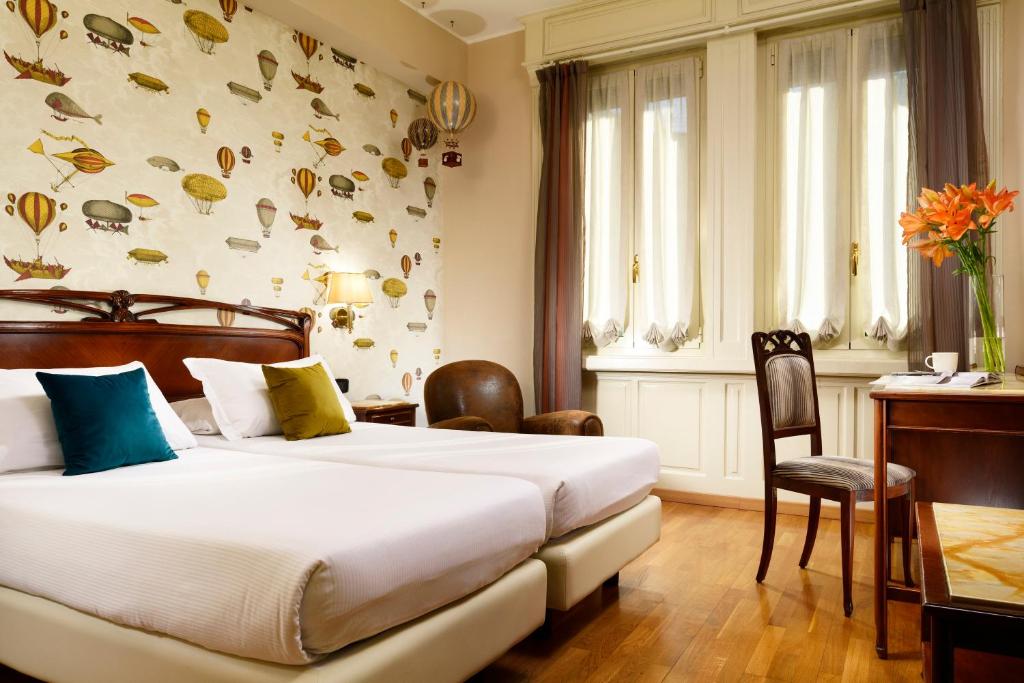 Postel nebo postele na pokoji v ubytování Hotel Continental Genova