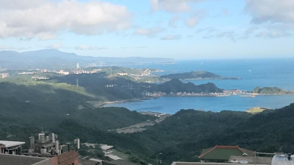 a view of a city and a body of water at Yun Cheng Homestay in Jiufen