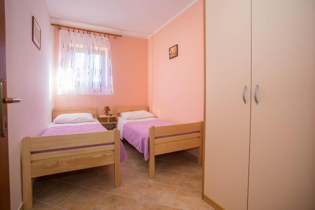 Posteľ alebo postele v izbe v ubytovaní Vitas
