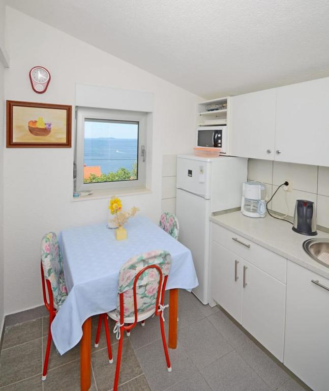 Kuchyňa alebo kuchynka v ubytovaní Apartments Doris