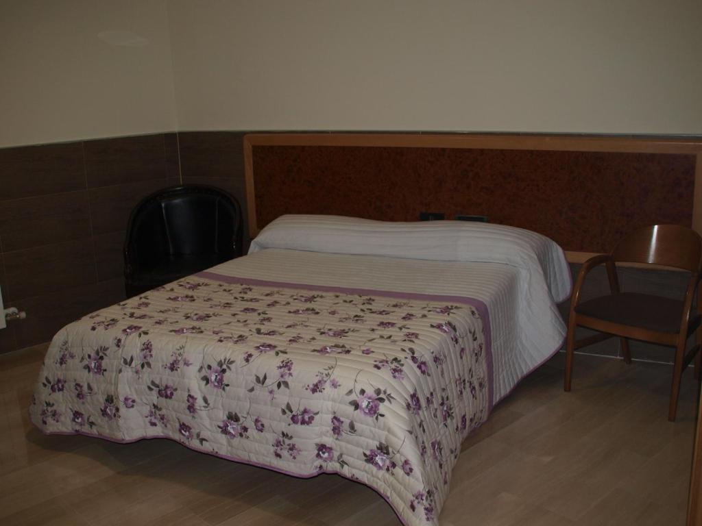 A bed or beds in a room at Domus Viatoris