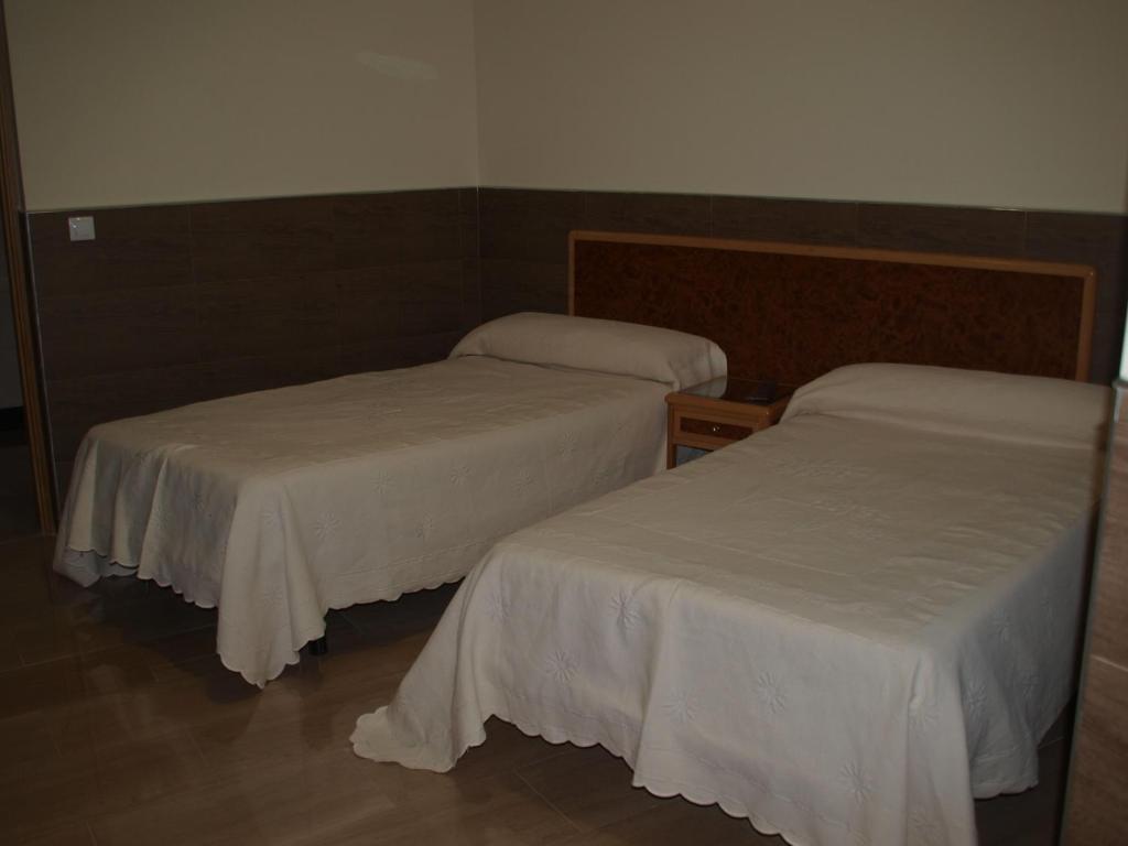 A bed or beds in a room at Domus Viatoris