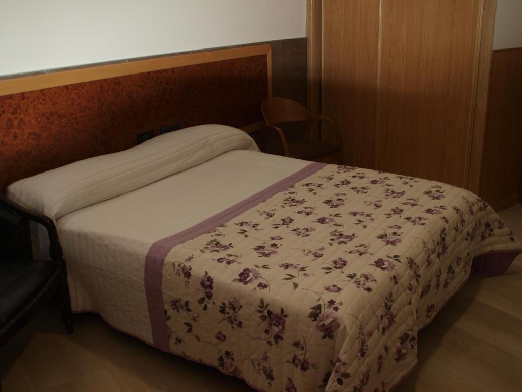 A bed or beds in a room at Domus Viatoris