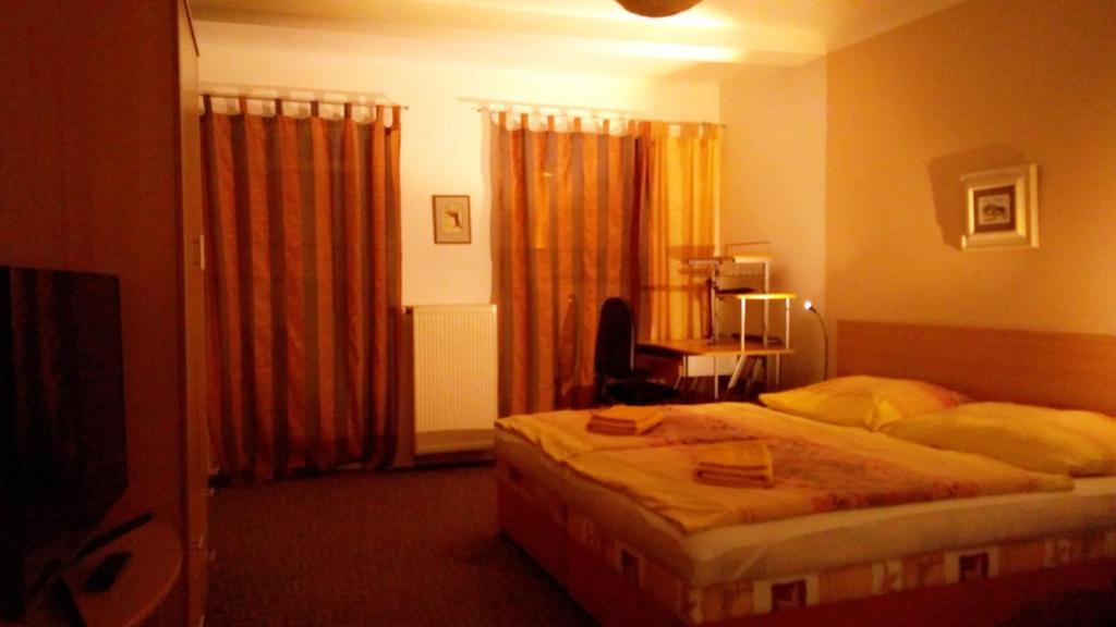 Postel nebo postele na pokoji v ubytování Apartmány - Penzion Smetanka