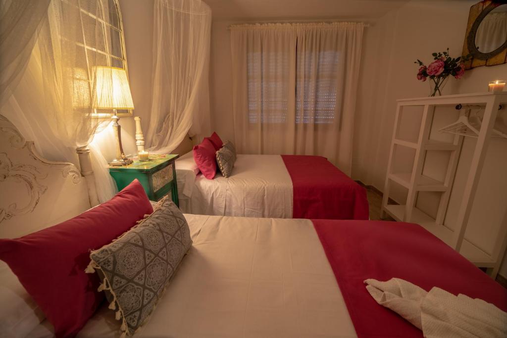 Postel nebo postele na pokoji v ubytování A&S Apartamentos Malaga