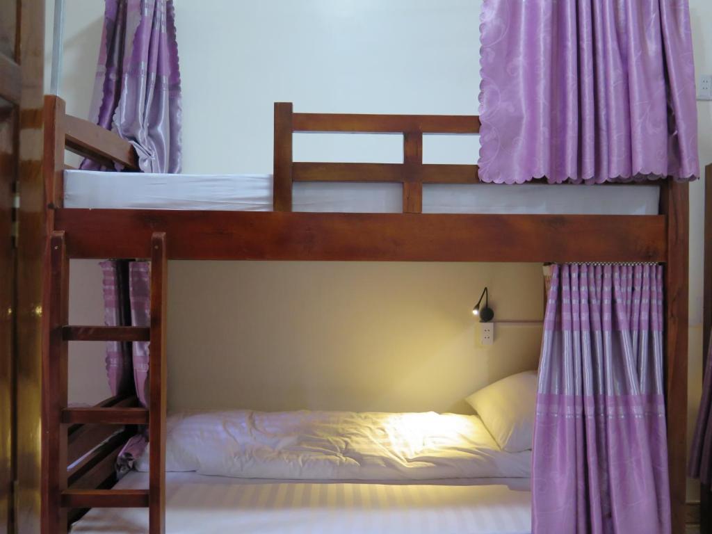 Postel nebo postele na pokoji v ubytování Ha Giang 1 Hostel and Loop Tour