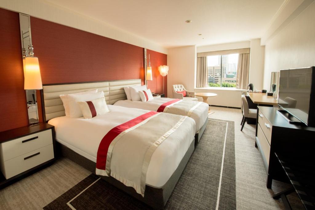 Postel nebo postele na pokoji v ubytování Tokyo Prince Hotel