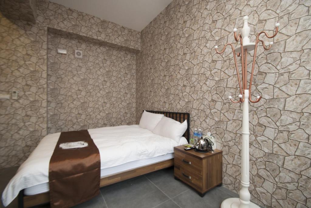 Postel nebo postele na pokoji v ubytování Yixiang Spring Travel