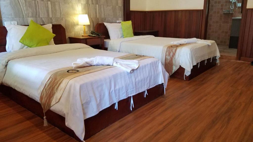 Postel nebo postele na pokoji v ubytování BayStone Resort