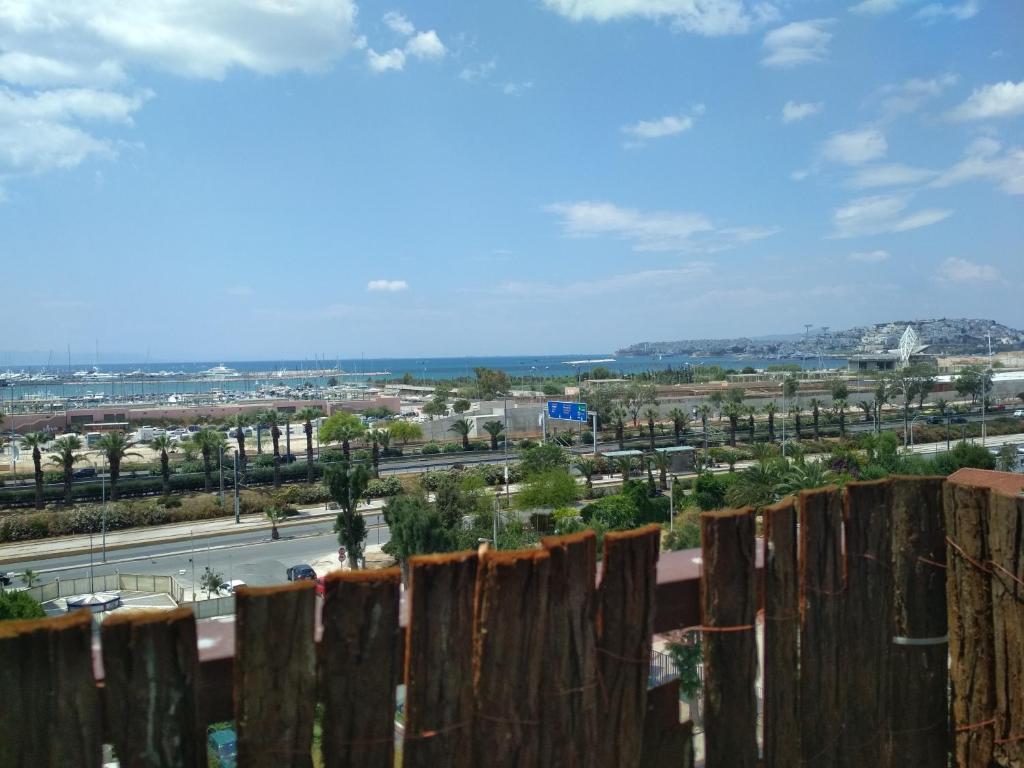 a view of a city from a fence at George's Apartment in Athens