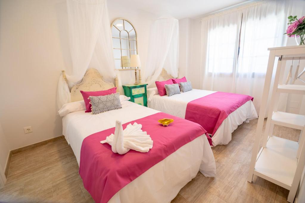 Postel nebo postele na pokoji v ubytování A&S Apartamentos Malaga