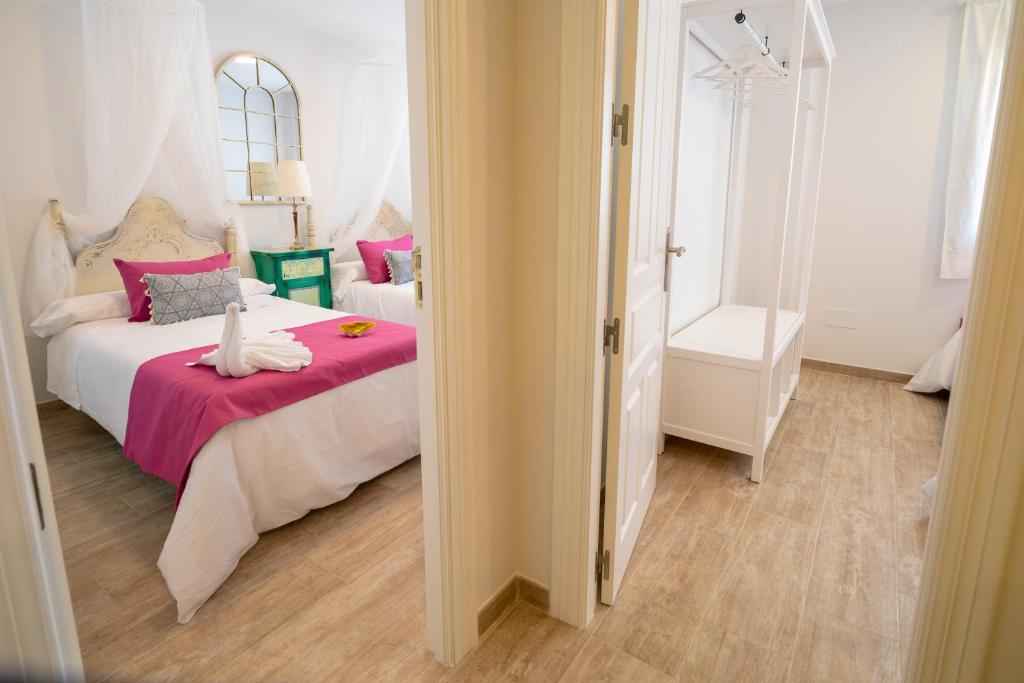 Postel nebo postele na pokoji v ubytování A&S Apartamentos Malaga