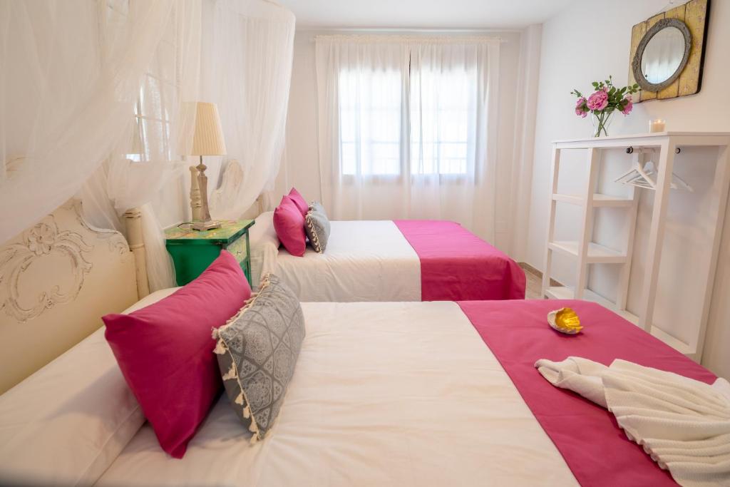 Postel nebo postele na pokoji v ubytování A&S Apartamentos Malaga