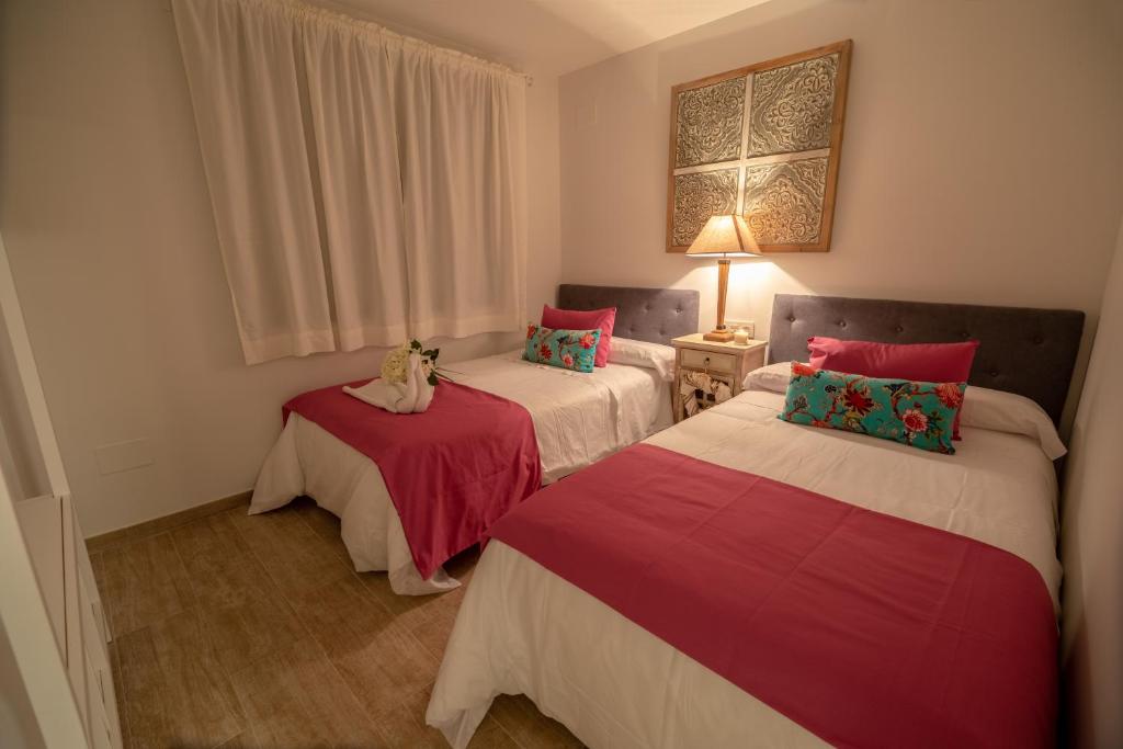 Postel nebo postele na pokoji v ubytování A&S Apartamentos Malaga