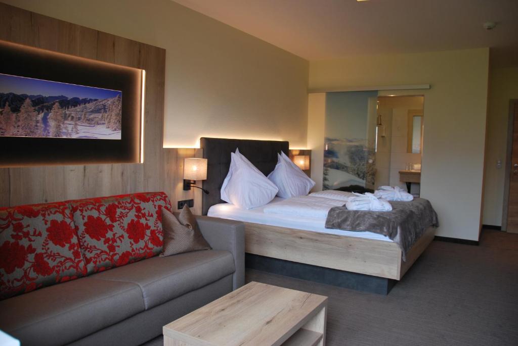 A bed or beds in a room at Hotel Pariente