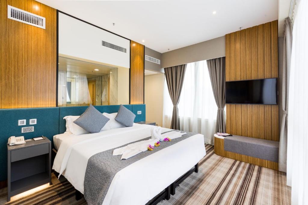 Postel nebo postele na pokoji v ubytování Eco Tree Hotel Causeway Bay