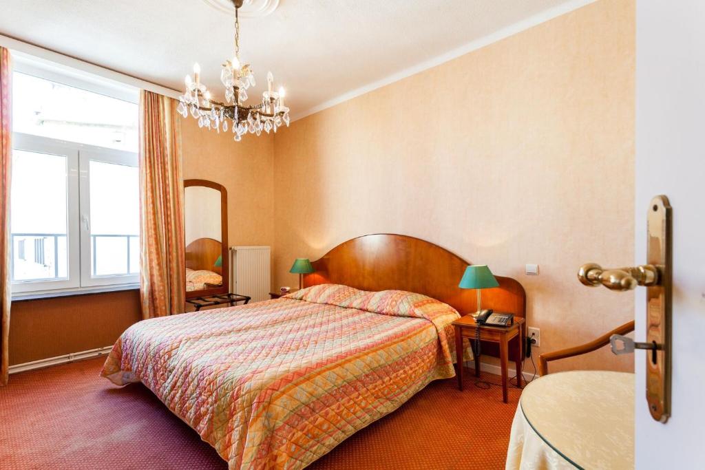 Postel nebo postele na pokoji v ubytování Avenue Hotel by F-Hotels