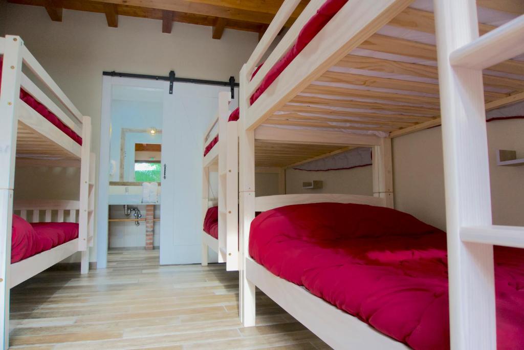 Postel nebo postele na pokoji v ubytování La Cala Hostel
