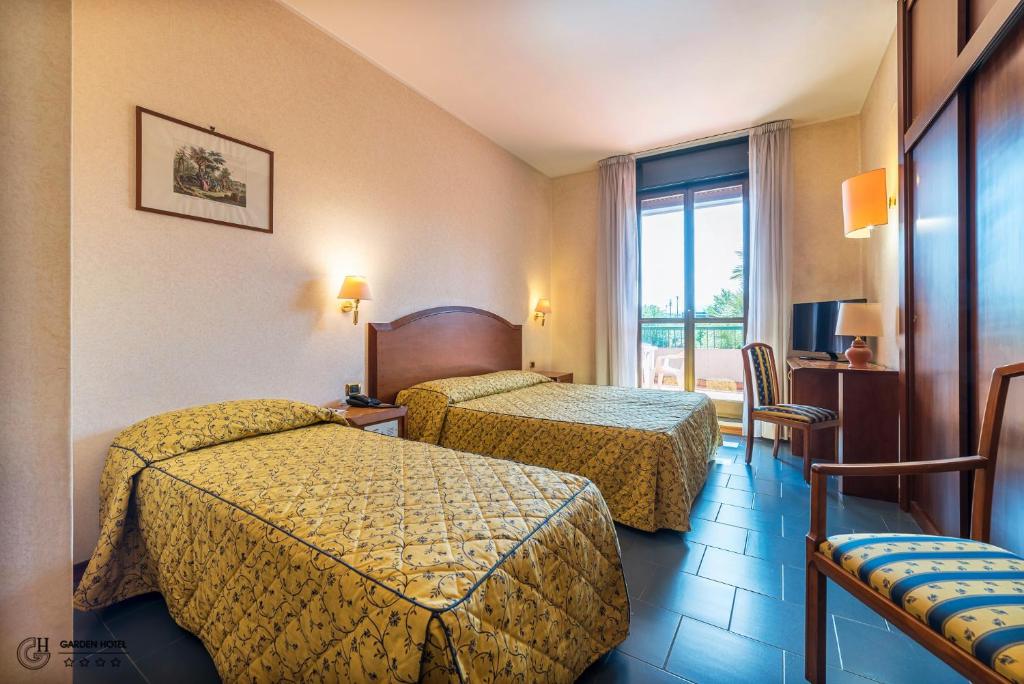 Postel nebo postele na pokoji v ubytování Hotel Garden Terni