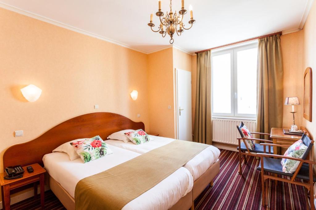 Postel nebo postele na pokoji v ubytování Malecot Hotel by F-Hotels