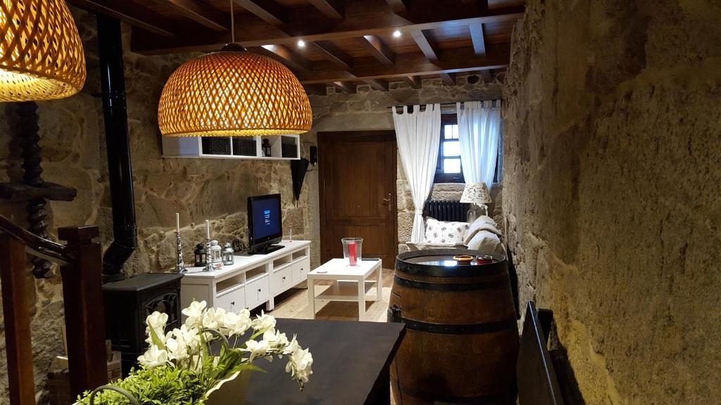 Televízia a/alebo spoločenská miestnosť v ubytovaní Casa Do Pazo