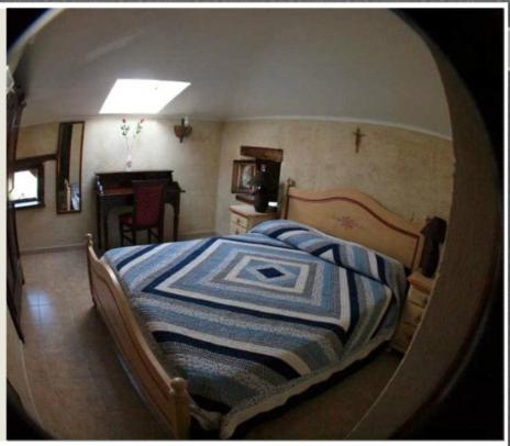 Postel nebo postele na pokoji v ubytování Vigna Della Signora