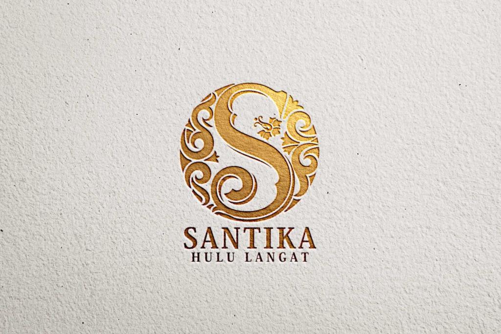 a sophisticated logo for a hindu restaurant with a gold sign at Santika in Kampong Jawa