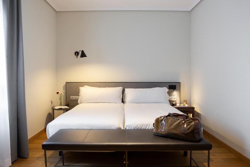 Cama o camas de una habitación en Petit Palace Triball
