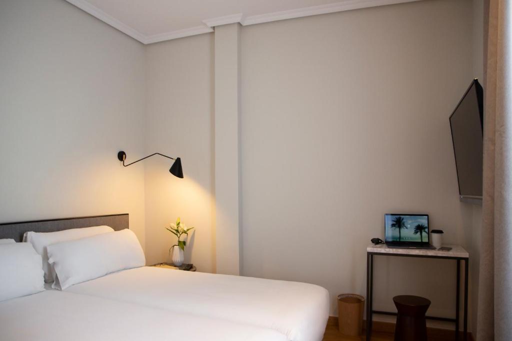 Cama o camas de una habitación en Petit Palace Triball