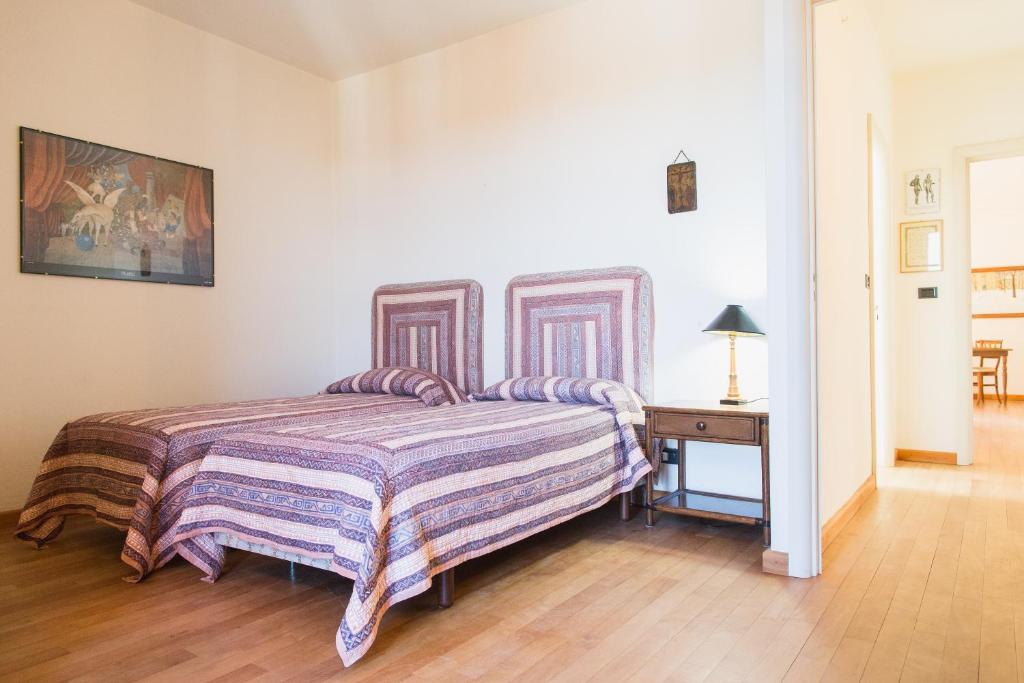 Łóżko lub łóżka w pokoju w obiekcie Villa Fiorita