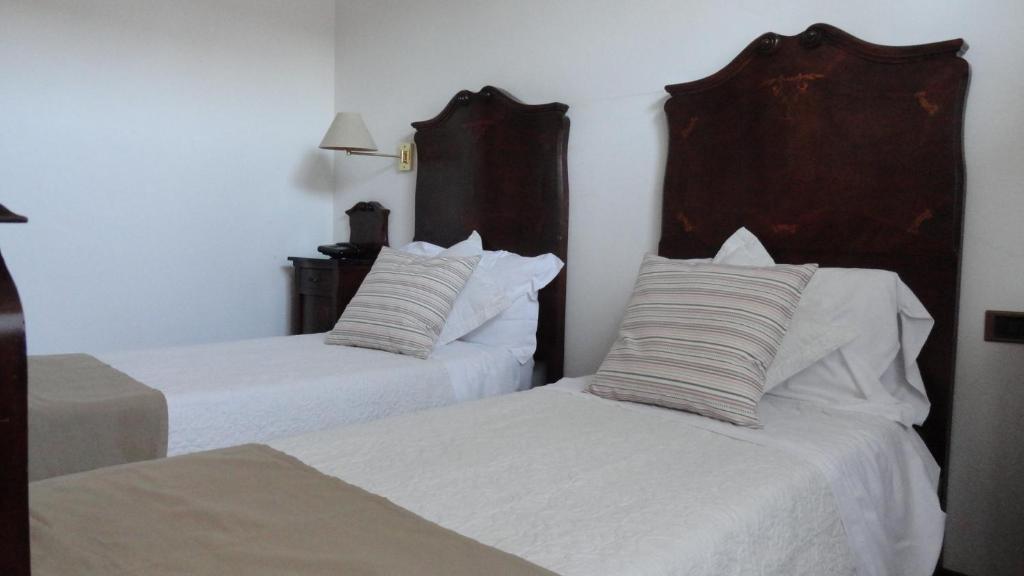 Postel nebo postele na pokoji v ubytování Albergo & Ristorante Selvatico