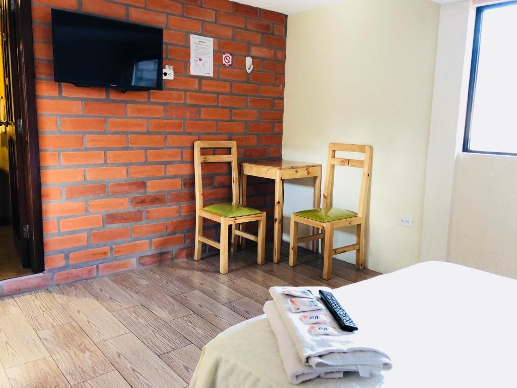 TV a/nebo společenská místnost v ubytování Hostal Monte Carmelo