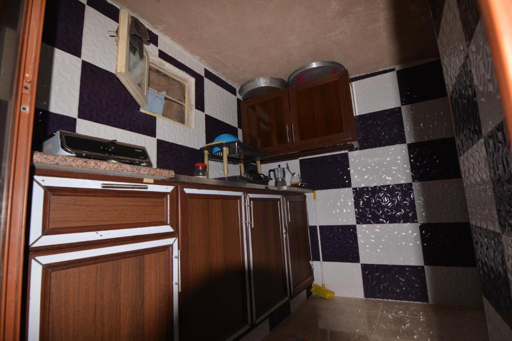 Kuchyň nebo kuchyňský kout v ubytování Petra Cottage