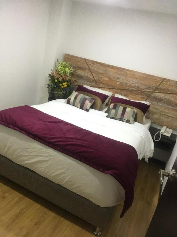 Postel nebo postele na pokoji v ubytování Hotel Funza Real