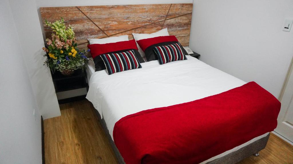 Postel nebo postele na pokoji v ubytování Hotel Funza Real